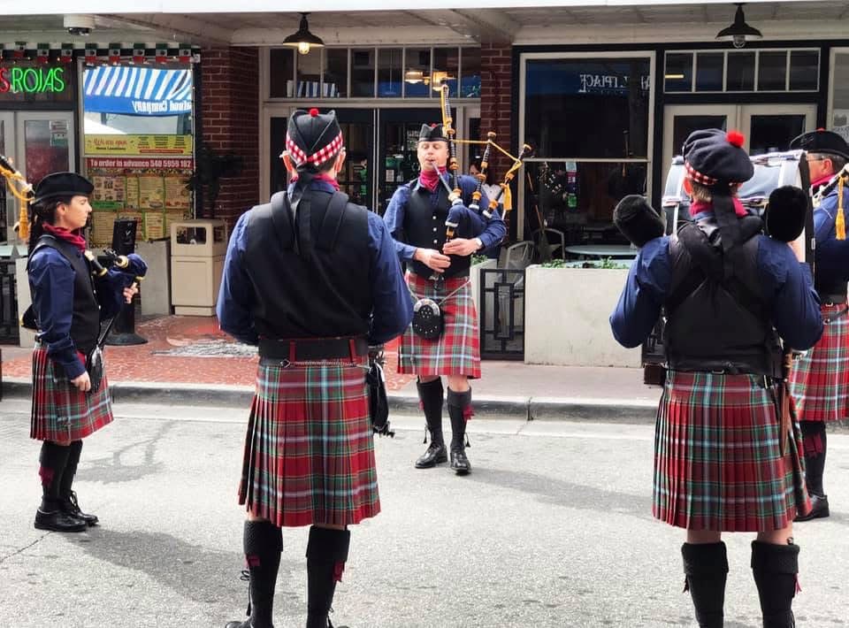 Appalachian Piping Academy performing outside of a pub.